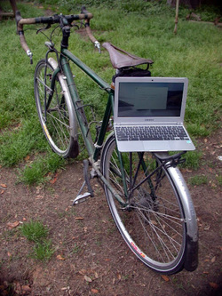 Picture of Google Chromebook Samsung and touring bike