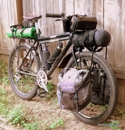 Picture of touring bike with racks, panniers, handlebar bag for bike touring