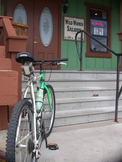 Picture of mountain bike parked in front of saloon