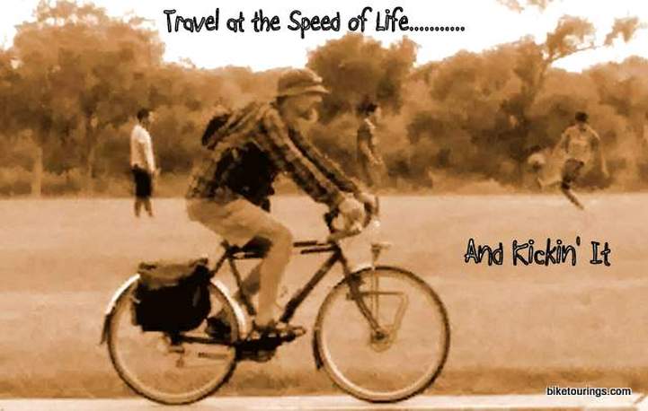 Picture of man riding touring bike with panniers