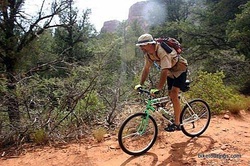 Picture of mountain bike touring with shade hat
