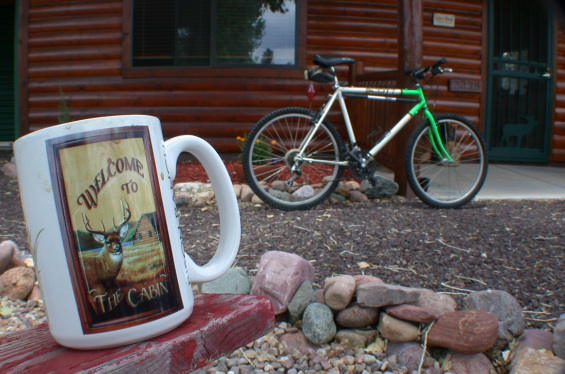 Picture of mountain bike parked in front of cabin