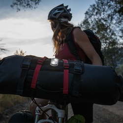 Picture of woman bike packing with blackburn 2 fer front or rear light