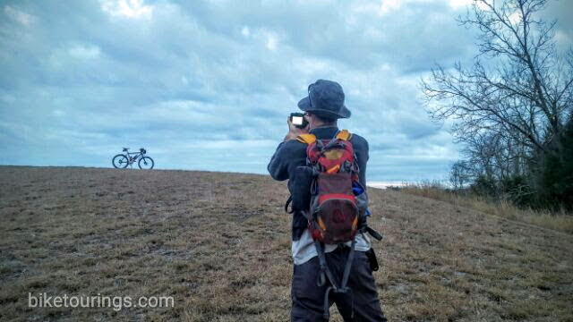Picture of touring bike and photographer while bicycle touring.