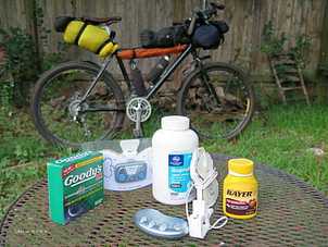 Picture of assorted pain relief remedies for sciatic pain with touring bike
