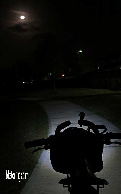 Picture of bike touring at night with front bicycle light