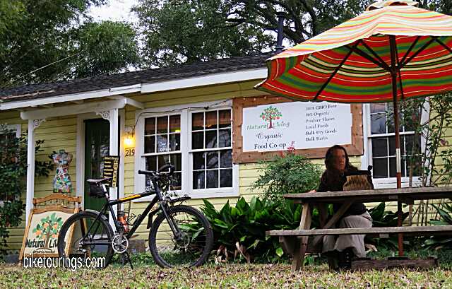 Picture mountain bike for bikepacking at Natural Living Co-op and Cafe with store owner Lisa Piper