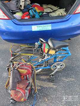 Picture of older model Dahon Mariner folding bike folded to fit in car trunk